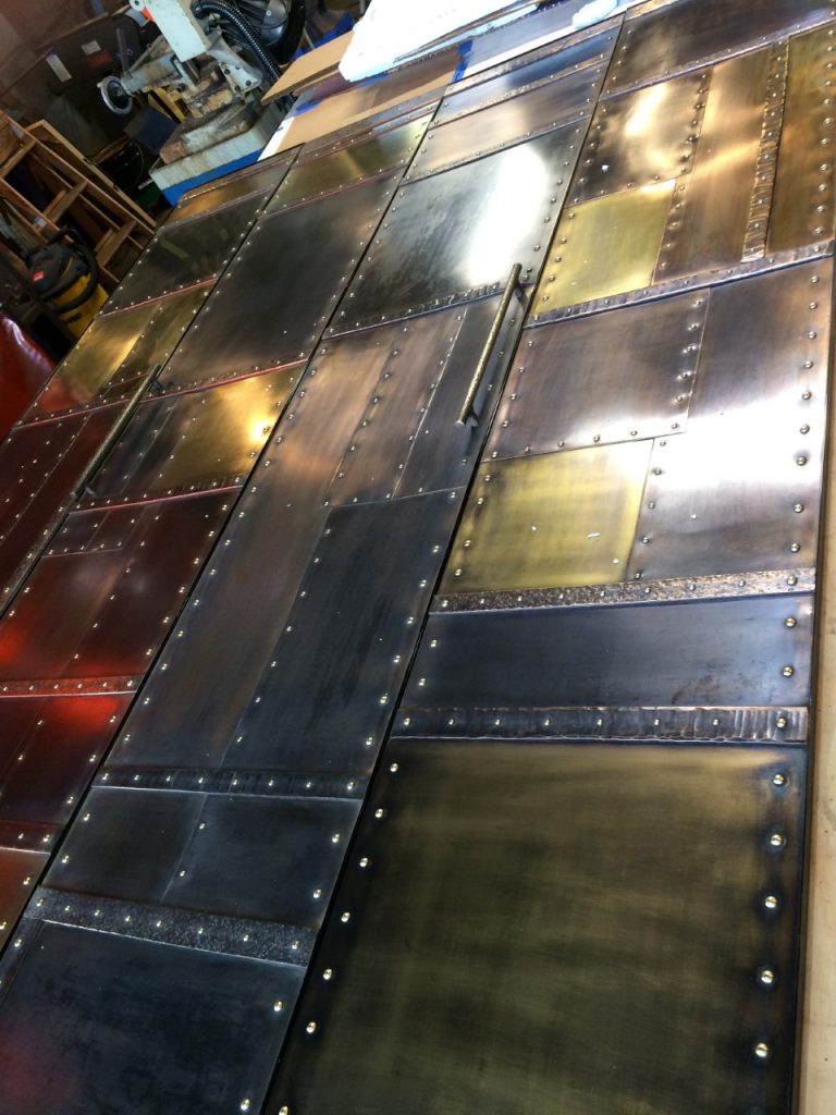 Hand buffed bronze and brass with a rich patina.