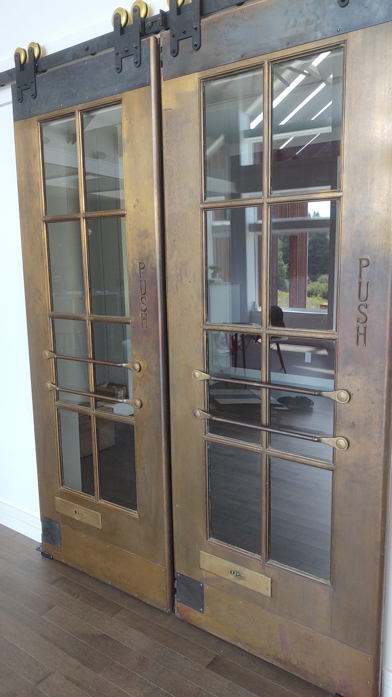antique brass doors, turned into hanging barn doors.