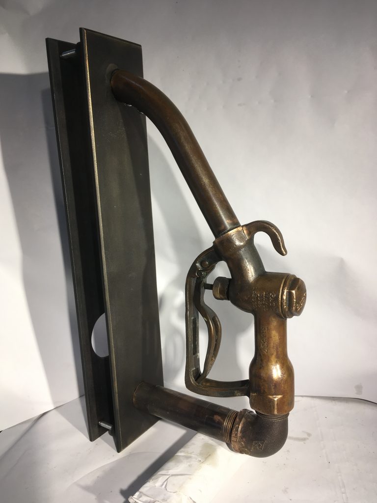 This vintage gas pump was turned into door pull.