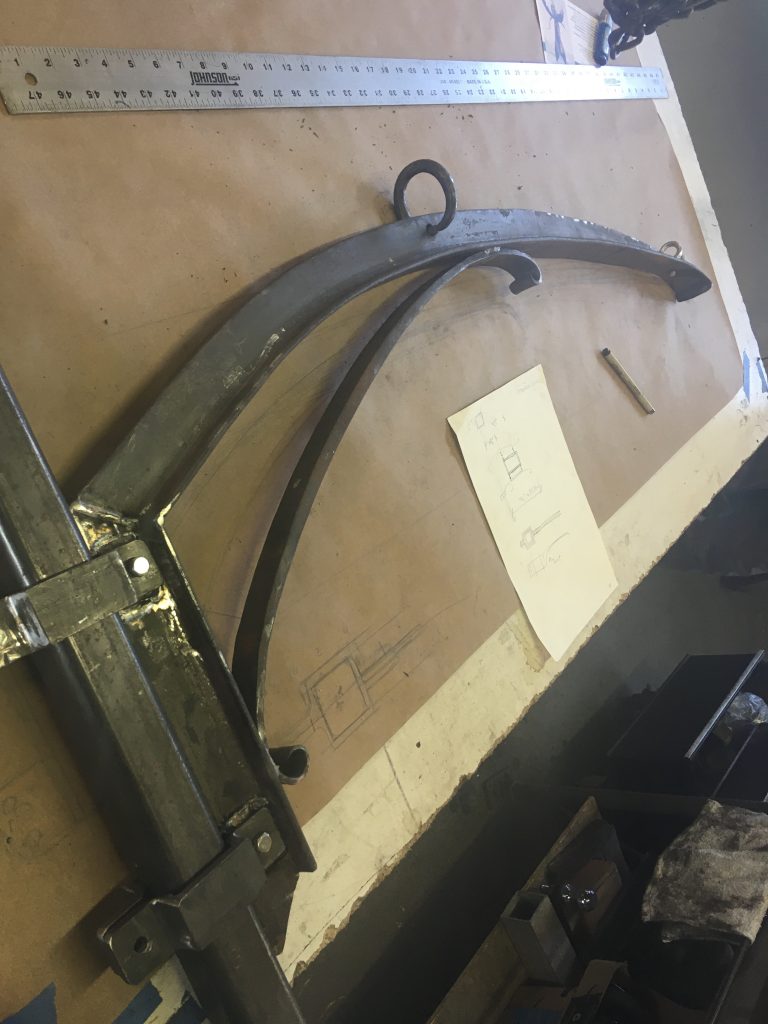 1/4" x 2" T bar bent to a radius for a decorative and structural bracket.