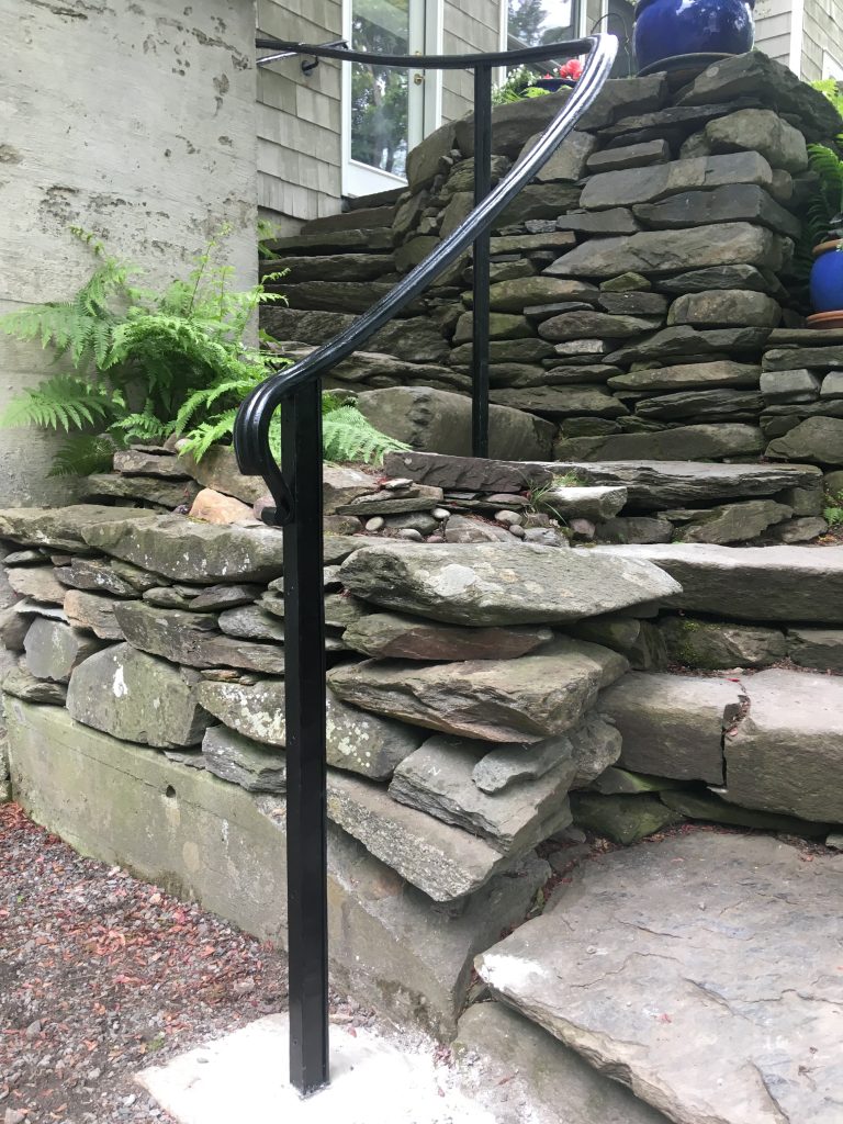 Newel post for a forged cap rail