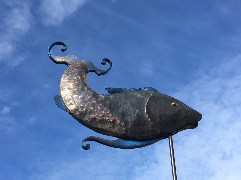 hammered silicon bronze fish that turns in the wind.