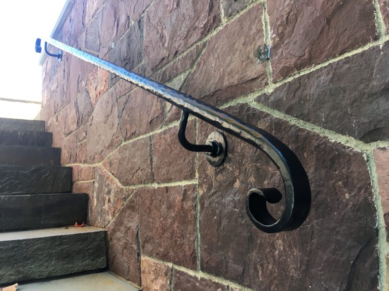 Solid round bar textured with scrolls.