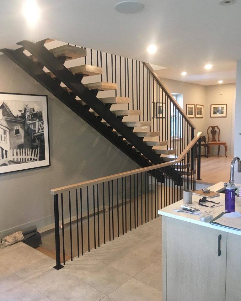 rectangular tube stringers and 5/8" diameter round rod balusters.