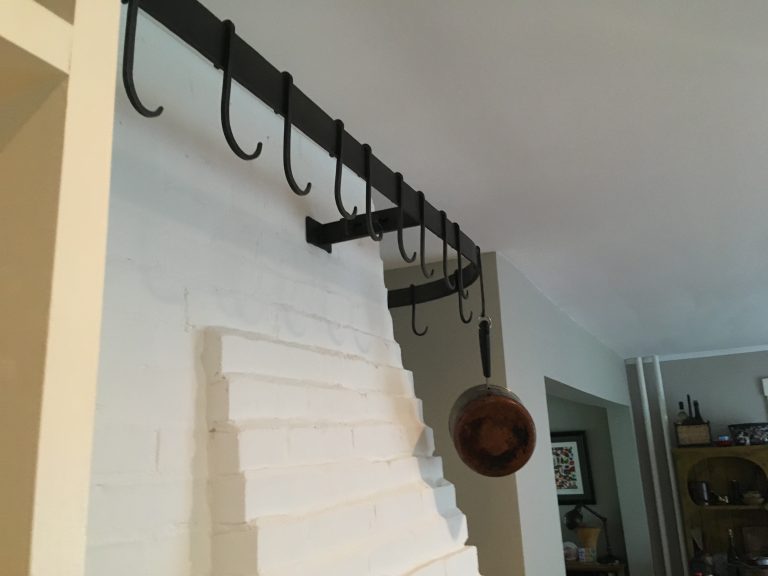 A potrack made from flat bar and forged hooks.