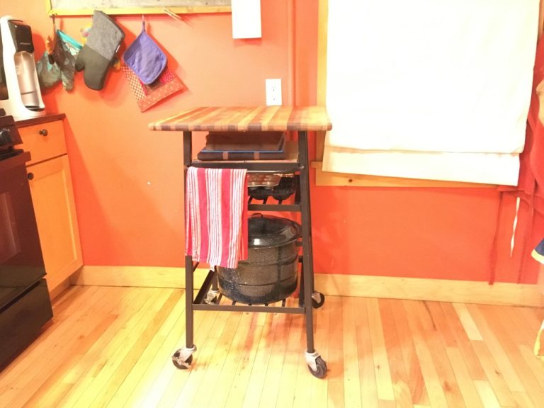 Rolling island table made from square bar and angle bar with a wood butcher block.