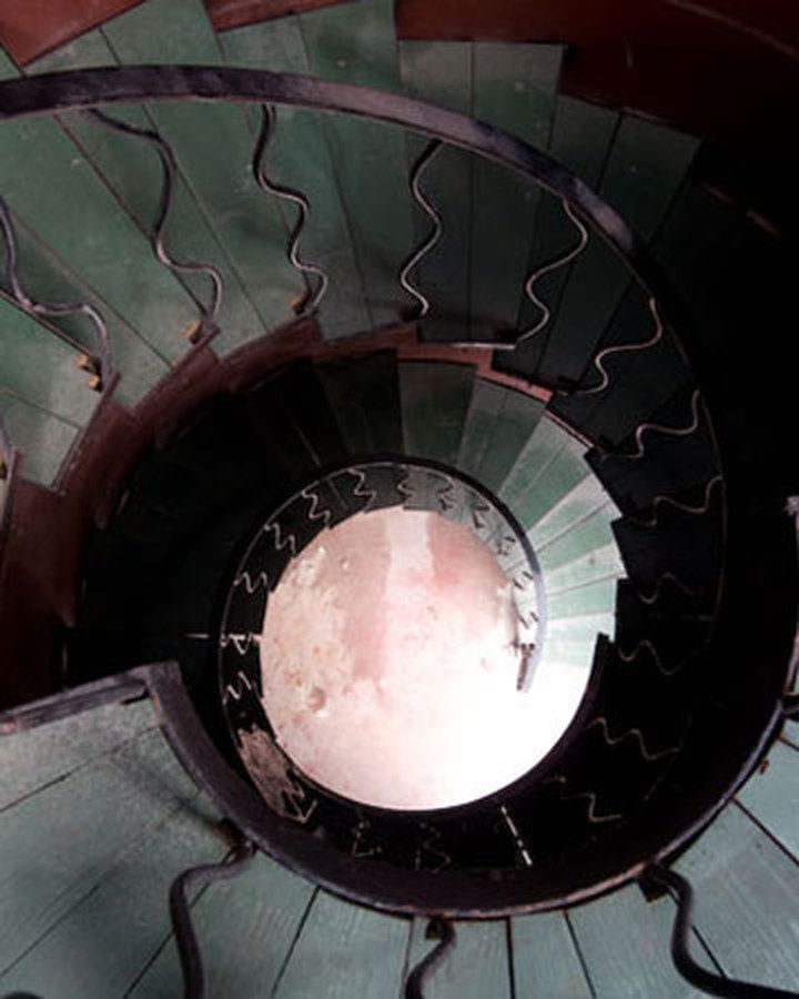 Spiral staircase with hand-forged wrought-iron railing by Champlain Metals, Burlington VT